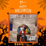 Person dressed as a skeleton playing guitar in front of a Halloween-themed backdrop with orange decorations and spider webs. Text reads "Happy Halloween.