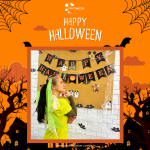 Person in a costume poses in front of a "Happy Halloween" banner, surrounded by festive decorations on an orange background with bats and spider webs.